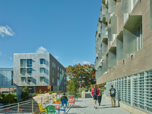 Photo of a residential area with buildings and people.