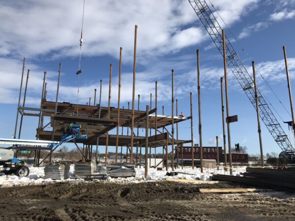 A building under construction, scaffolding in place.